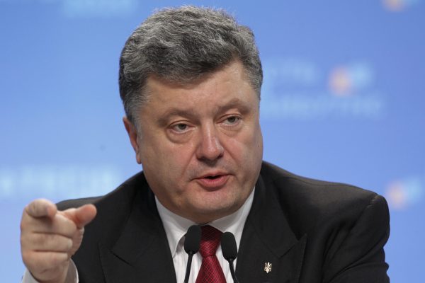 Ukraine's President Petro Poroshenko speaks to the media during a news conference in Kiev, September 25, 2014. Ukraine and the rest of the world will not recognize local elections planned by pro-Russian separatists next month, Poroshenko said on Thursday, adding that he hoped Russia would follow the same course. REUTERS/Valentyn Ogirenko (UKRAINE - Tags: POLITICS HEADSHOT)