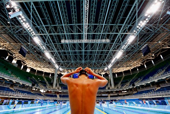 RIO DE JANEIRO, BRAZIL - AUGUST 01: A competitor prepares to swim during a training session at the Olympic Aquatics Stadium in the Olympic Park on August 1, 2016 in Rio de Janeiro, Brazil. (Photo by Clive Rose/Getty Images)