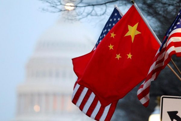 The People's Republic of China flag and the U.S. Stars and Stripes fly along Pennsylvania Avenue near the U.S. Capitol in Washington during Chinese President Hu Jintao's state visit, January 18, 2011. Hu arrived in the United States on Tuesday for a state visit with U.S. President Barack Obama that is aimed at strengthening ties between the world's two biggest economies. REUTERS/Hyungwon Kang (UNITED STATES - Tags: POLITICS)